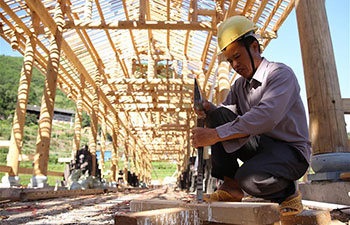 Villagers repair houses, bridges in slack farming season in China's Guizhou